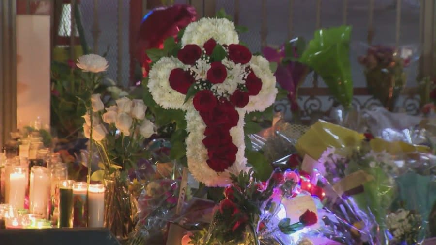 A community held a candlelight vigil outside the Star Ballroom Dance Studio in Monterey Park to remember loved ones lost during a mass shooting. (KTLA)
