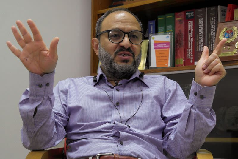 Ejaz A. Khan, Chief of Pediatrics and clinical in charge of Ad5-nCoV Phase III trial gestures during an interview with Reuters, in Islamabad