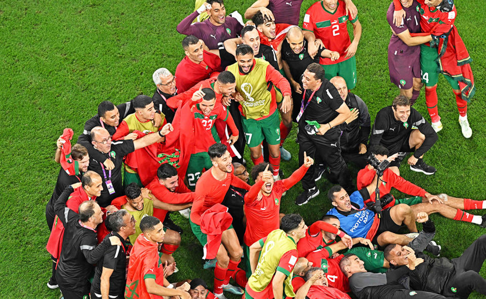 Morocco players and officials, pictured here celebrating after their win over Spain at the World Cup.