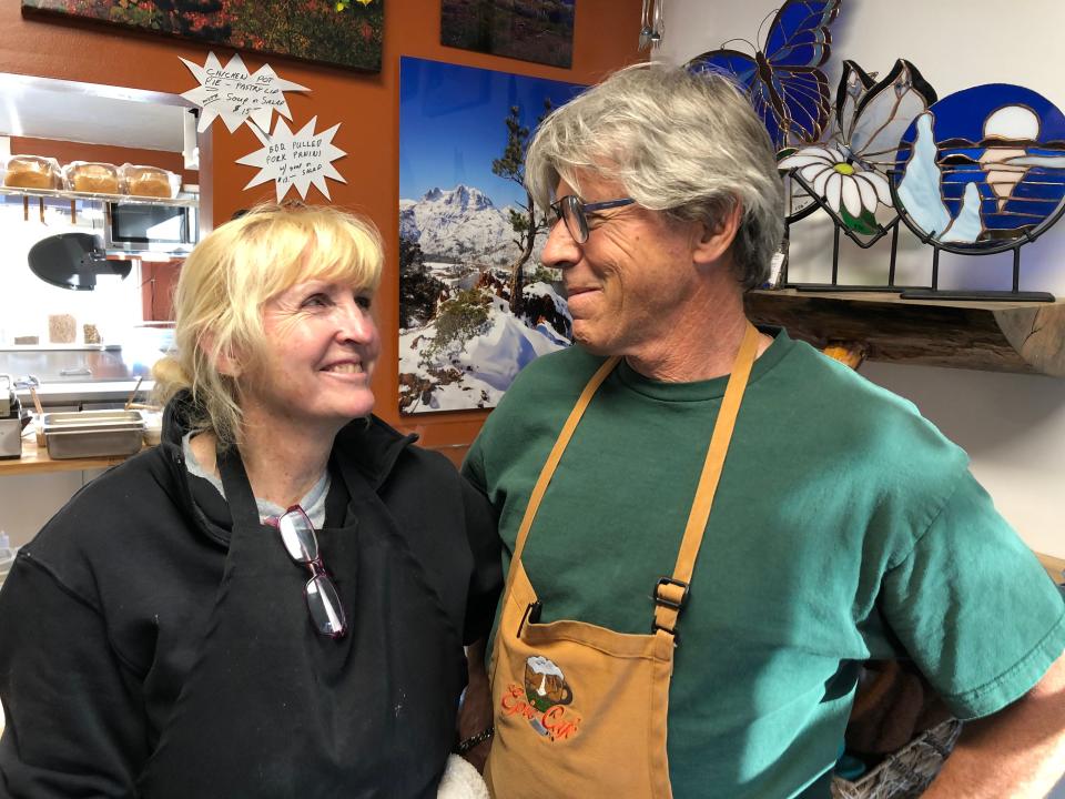 Linda and Dave Dore of Lee Vining, Calif., share a smile in their takeaway restaurant, Epic Cafe, in nearby June Lake on May 11, 2022. Like other business owners in the region, they've been hit hard by high gas prices.