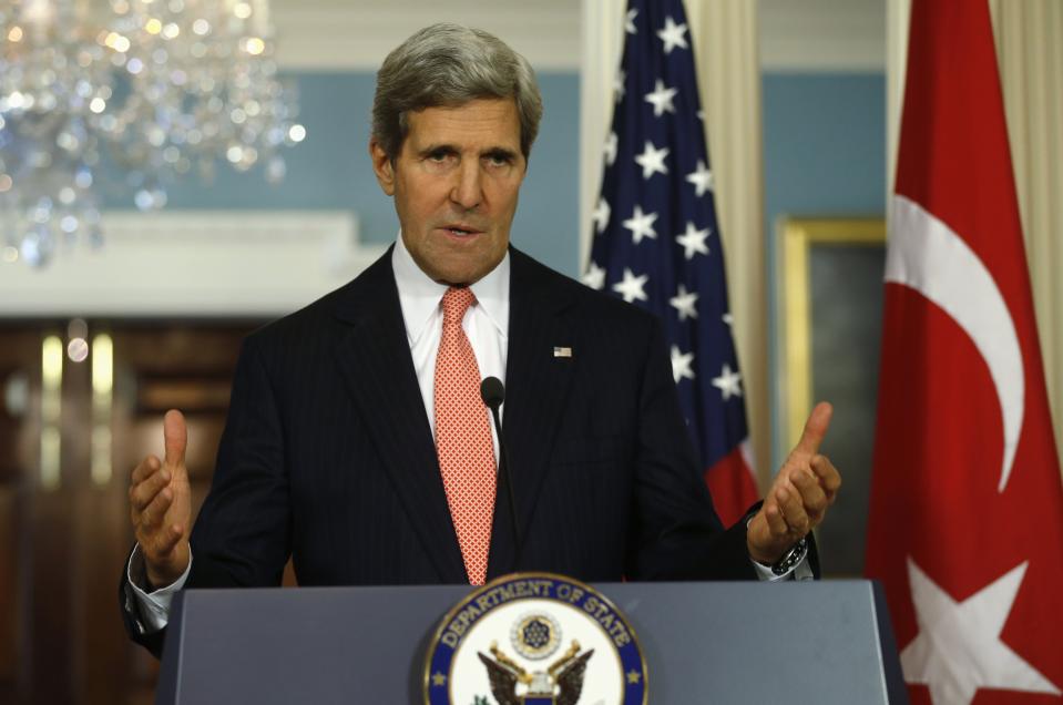 U.S. Secretary of State John Kerry answers a question as he and Turkish Foreign Minister Ahmet Davutoglu speak to reporters at the State Department in Washington November 18, 2013. REUTERS/Kevin Lamarque (UNITED STATES - Tags: POLITICS)