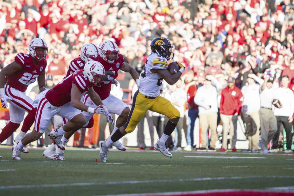 Iowa running back Akrum Wadley (25) rushes for a touchdown against Nebraska during the first half of an NCAA college football game in Lincoln, Neb., Friday, Nov. 24, 2017. (AP Photo/John Peterson)