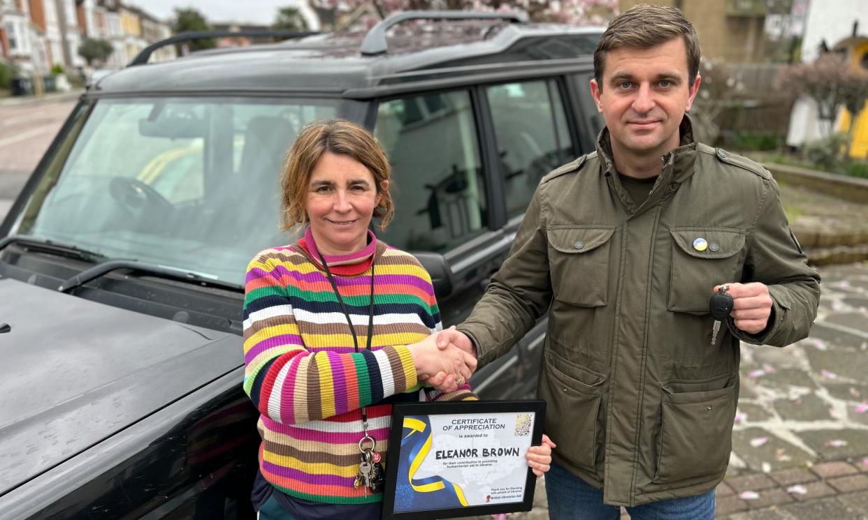 <span>Eleanor Brown, of Forest Hill, London, hands the keys of her Land Rover Discovery to Bohdan Bolonnyy, of British Ukrainian Aid. Instead of being scrapped the vehicle will be delivered to a paramedic in Ukraine.</span><span>Photograph: BUA/Richard Lofthouse</span>