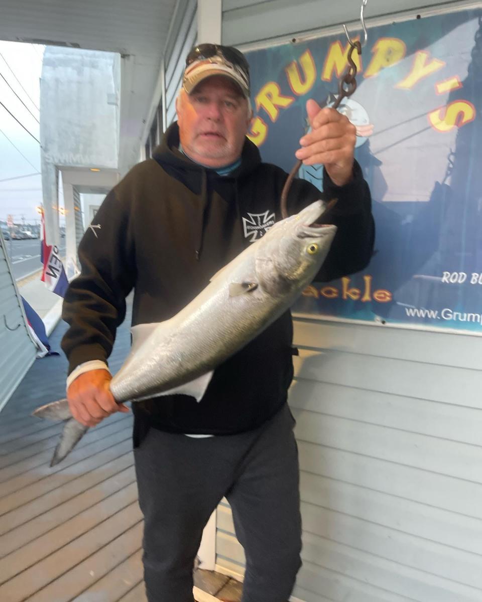 Bob Ferguson with an 8-pound bluefish he caught from Barnegat Bay.