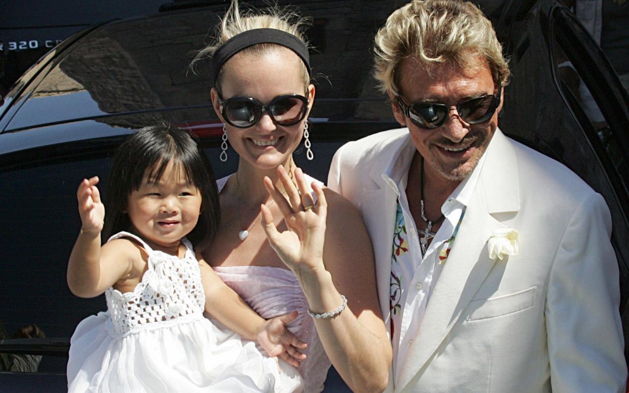 The late French singer and actor Johnny Hallyday, his wife Laeticia and their daughter Jade, arriving to the Baux-de-Provence's townhall, southern France, in 2017 - AFP