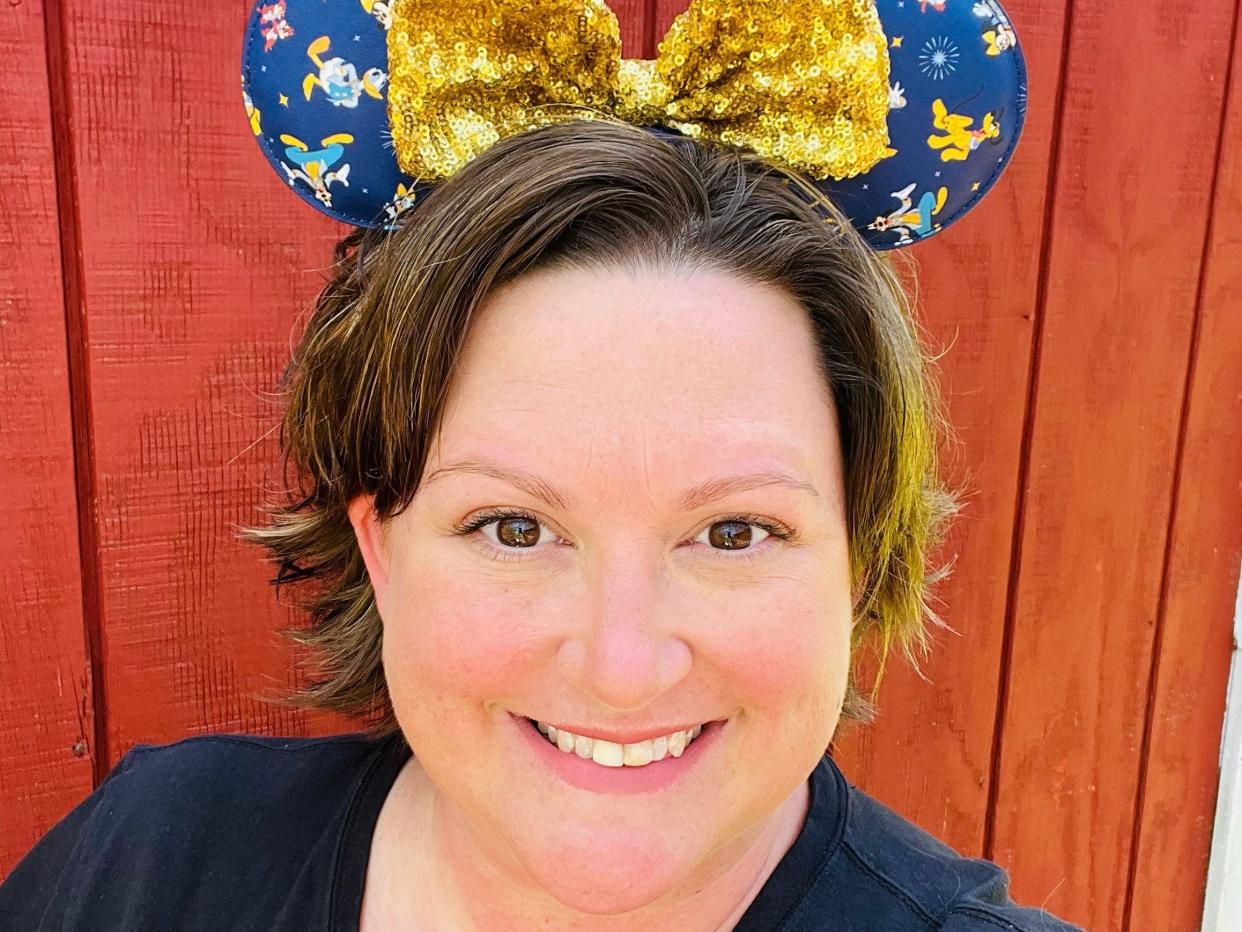 jennifer posing wearing toy-story themed minnie ears