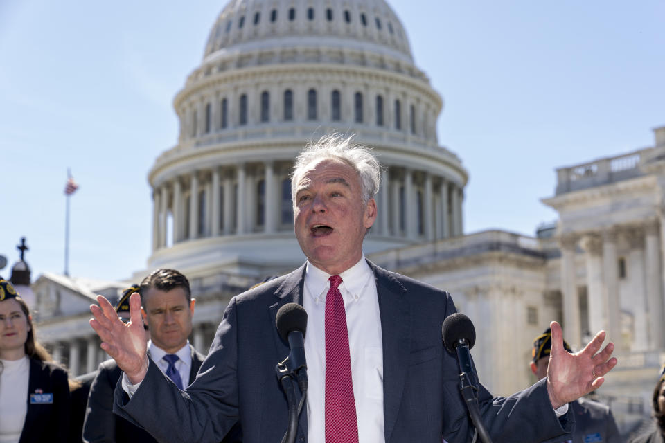 Sen. Tim Kaine, D-Va., center, and Sen. Todd Young, R-Ind., center left, are joined by representatives of the American Legion as they speak to reporters about ending the authorization for use of military force enacted after the Sept. 11, 2001, terrorist attacks, at the Capitol in Washington, Thursday, March 16, 2023. Senators voted 68-27 Thursday to move forward with a bill to repeal the 2002 measure that authorized the March 2003 invasion of Iraq and a 1991 measure that sanctioned the U.S.-led Gulf War to expel Iraqi leader Saddam Hussein's forces from Kuwait. (AP Photo/J. Scott Applewhite)