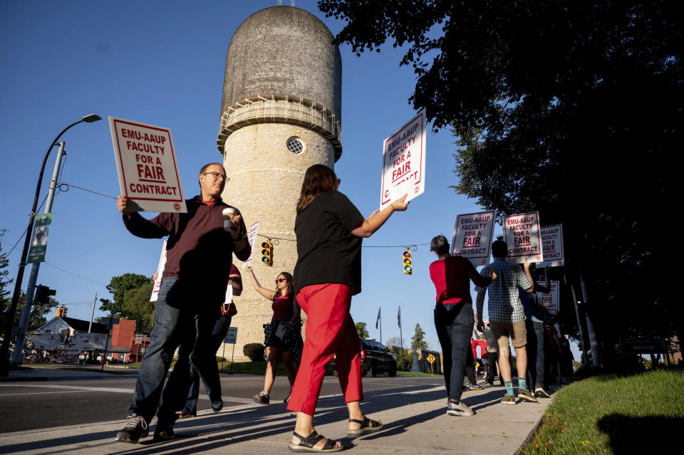 Eastern Michigan University faculty strike outside Welch Hall along Cross Street in Ypsilanti on Wednesday, Sept. 7, 2022. Several dozen faculty at Eastern Michigan University began a strike Wednesday after their union and the school's administration failed to agree on a new labor contract. (Jacob Hamilton/Ann Arbor News via AP)