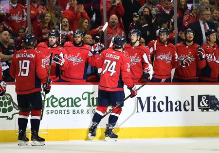 Nov 10, 2017; Washington, DC, USA; Washington Capitals defenseman John Carlson (74) is congratulated by teammates after scoring a goal against the Pittsburgh Penguins during the first period at Capital One Arena. Mandatory Credit: Brad Mills-USA TODAY Sports