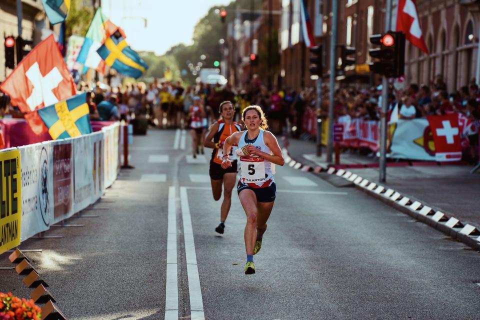 a group of people running on a street