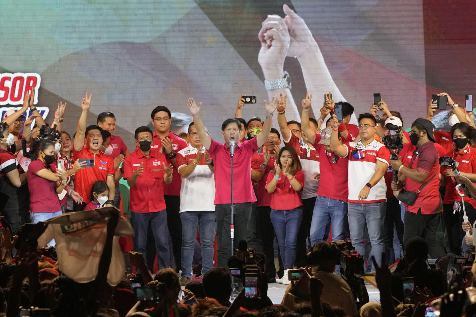 Ferdinand "Bongbong" Marcos Jr. gestures as he greets the crowd during a campaign rally in Quezon City, Philippines on April 13, 2022. Marcos Jr., son of the late dictator and his running mate Sara, who is the daughter of the outgoing President Rodrigo Duterte, are leading pre-election surveys despite his family's history. (AP Photo/Aaron Favila)