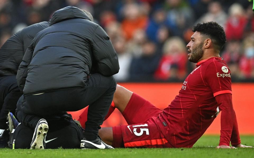 Oxlade-Chamberlain receives medical attention - PAUL ELLIS/AFP via Getty Images