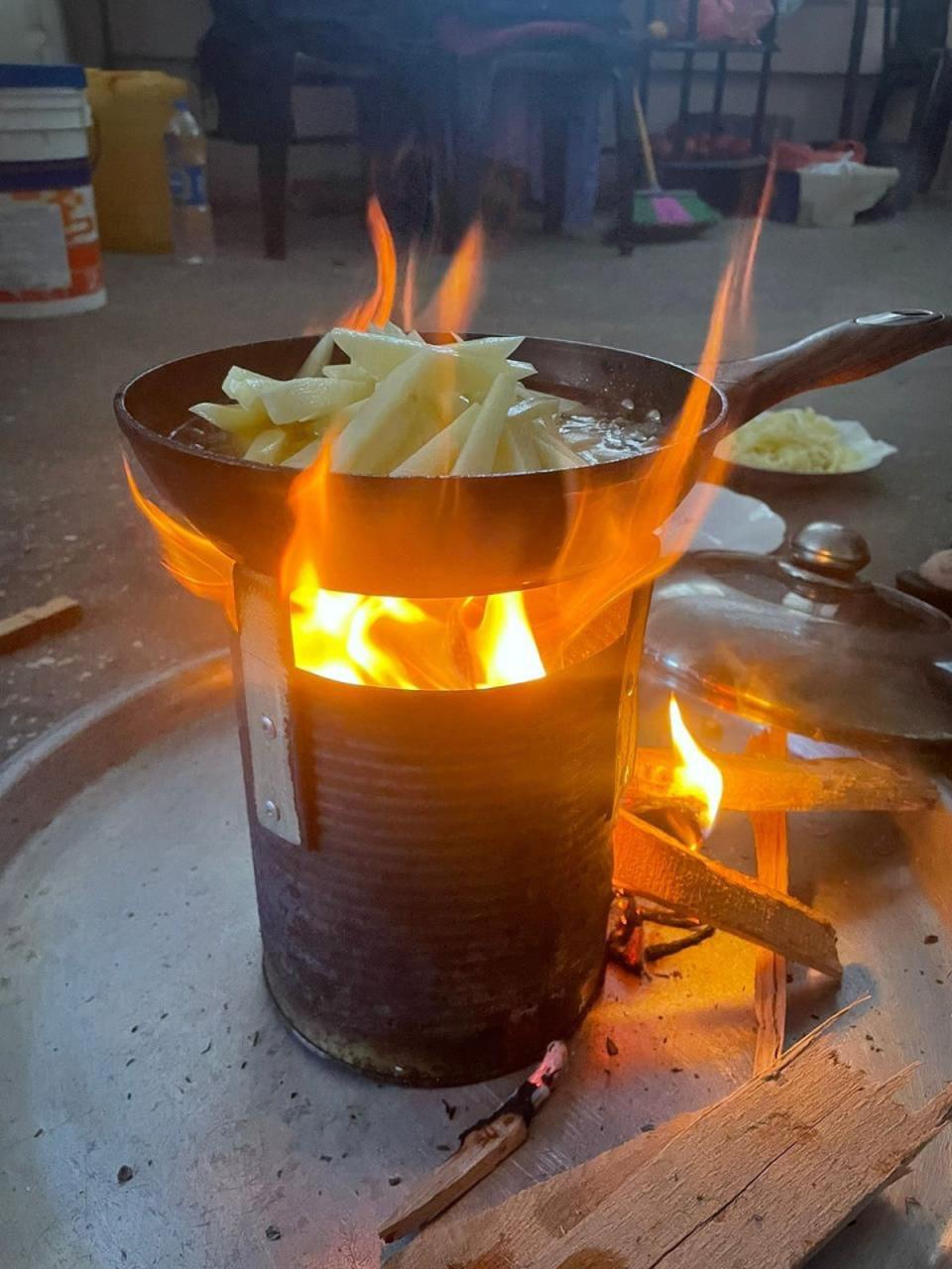 The family were forced to cook on wood after supplies of cooking oil depleted (Provided)