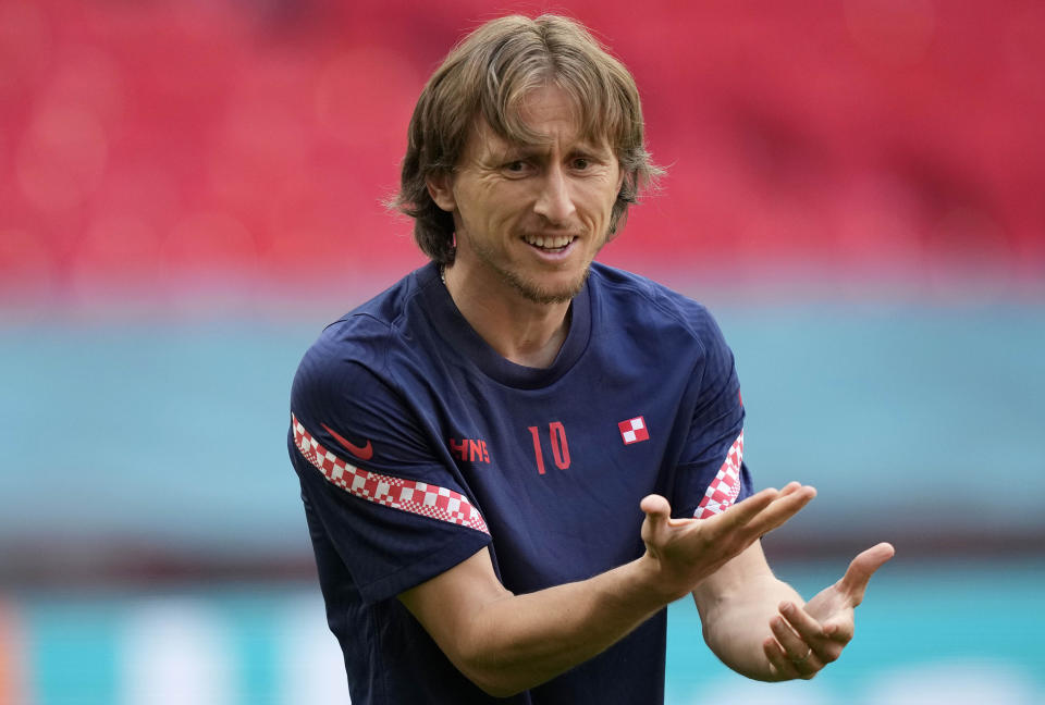 Croatia's Luka Modric gestures during a team training session at Wembley stadium in London, Saturday, June 12, 2021 the day before the Euro 2020 soccer championship group D match between England and Croatia. (AP Photo/Frank Augstein)