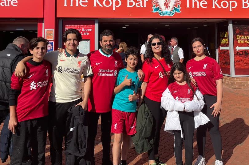 Kemal Coskuncay with his family of Liverpool FC supporters