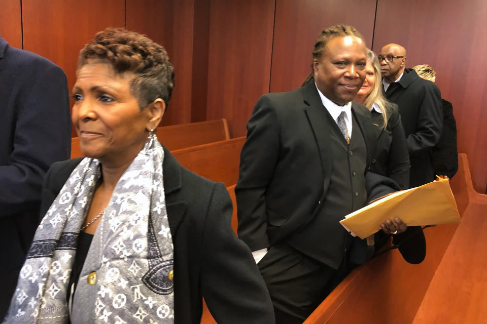 Sabrina Owens, left, the niece of Aretha Franklin, and Franklin's son, Ted White, right, leave a courtroom in Pontiac, Mich., Tuesday. March 3, 2020. A judge accepted Owens' resignation as personal representative, or executor, of the late singer's estate but declined to appoint White as an interim replacement. (AP Photo/Ed White)