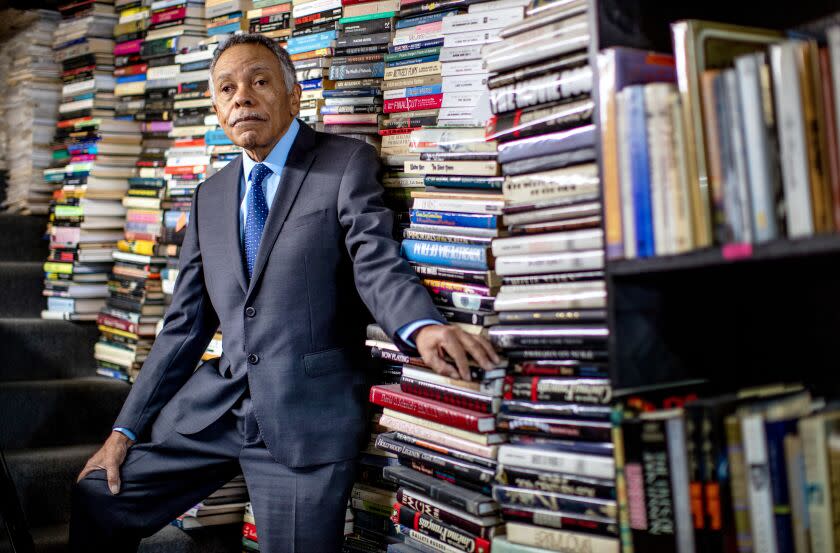 LOS ANGELES, CA - FEBRUARY 9, 2023: Standing next to stacks of books inside Larry Edmunds Bookstore, longtime movie publicist and author Luis Reyes's new book "Viva Hollywood" is being published by Turner Classics on February 9, 2023 in Los Angeles, California. His book illustrates a century of Latino and Spanish contributions to film culture.(Gina Ferazzi / Los Angeles Times)