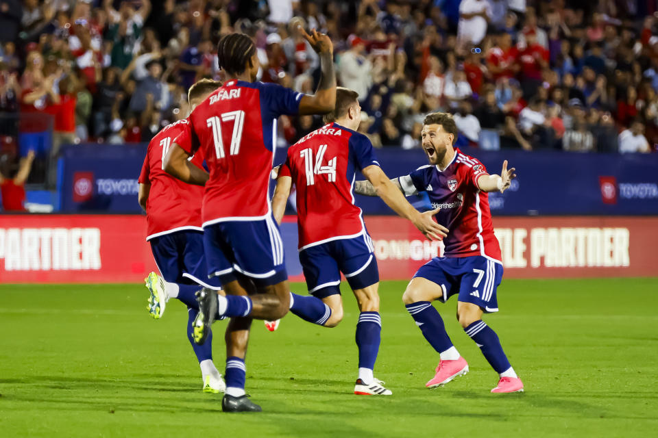 FC Dallas midfielder Asier Illarramendi (14) is congratulated by teammates, including forward Paul Arriola (7), after scoring during an MLS soccer match against the San Jose Earthquakes, Saturday, Feb. 24, 2024, in Frisco, Texas. (AP Photo/Brandon Wade)