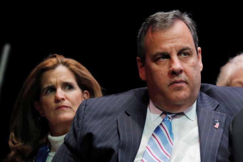 FILE PHOTO: Former New Jersey Governor Chris Christie and his wife, Mary Pat, listen to newly sworn in New Jersey Governor, Phil Murphy, speaking after taking the oath of office in Trenton, New Jersey