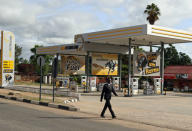 A man walks past a gas station in Harare, Zimbabwe, January 21, 2019. REUTERS/Philimon Bulawayo