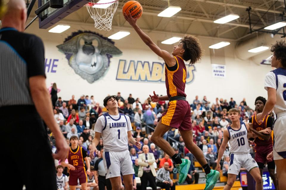 Rocky Mountain's Avantae Hood puts up a shot during a game against Fort Collins High School in Fort Collins, Colo., on Thursday, Feb. 15, 2024.