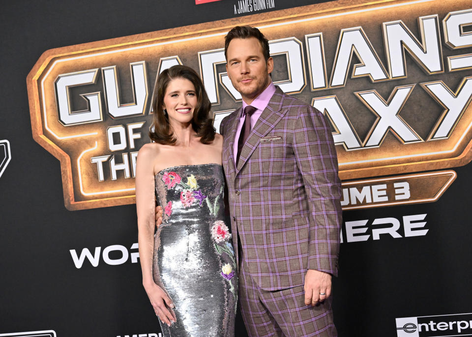 Katherine Schwarzenegger and Chris Pratt at the premiere of Guardians of the Galaxy Volume 3. Katherine is wearing a strapless sequined dress with flower details. Chris is wearing a plaid suit
