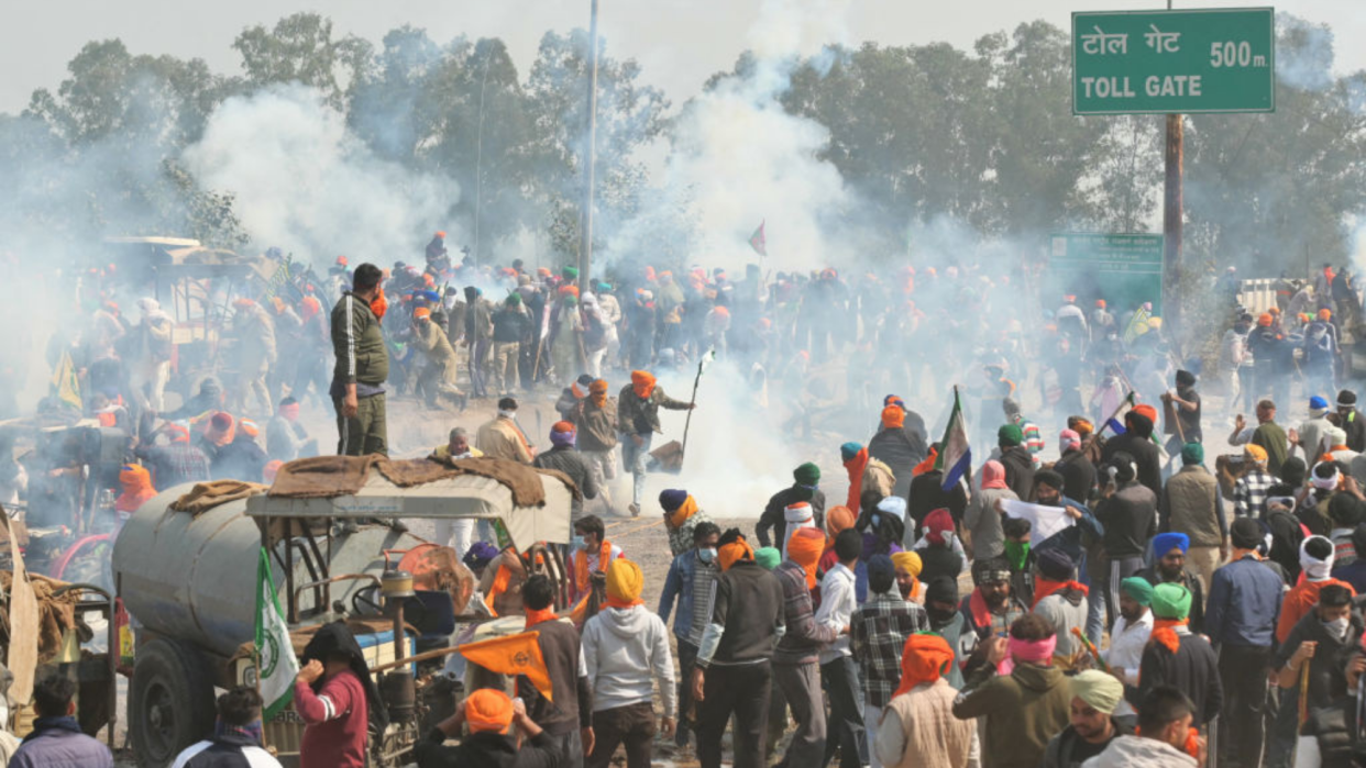  Protesters are pictured being targeted with tear gas. 