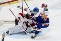 New Jersey Devils goaltender Mackenzie Blackwood (29) stops a shot by New York Islanders' Brock Nelson (29) as Damon Severson (28) defends during the second period of an NHL hockey game Thursday, May 6, 2021, in Uniondale, N.Y. (AP Photo/Frank Franklin II)