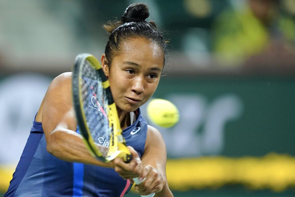 Leylah Fernandez returns shot to Alize Cornet, or France, at the BNP Paribas Open tennis tournament Friday Oct. 8, 2021, in Indian Wells, Calif. (AP Photo/Mark J. Terrill)