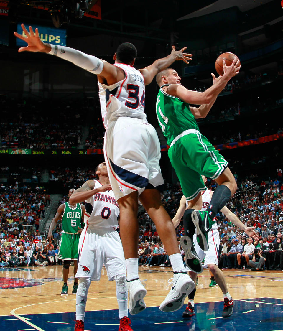 ATLANTA, GA - MAY 01: Sasha Pavlovic #11 of the Boston Celtics drives against Jason Collins #34 of the Atlanta Hawks in Game Two of the Eastern Conference Quarterfinals in the 2012 NBA Playoffs at Philips Arena on May 1, 2012 in Atlanta, Georgia. NOTE TO USER: User expressly acknowledges and agrees that, by downloading and or using this photograph, User is consenting to the terms and conditions of the Getty Images License Agreement. (Photo by Kevin C. Cox/Getty Images)