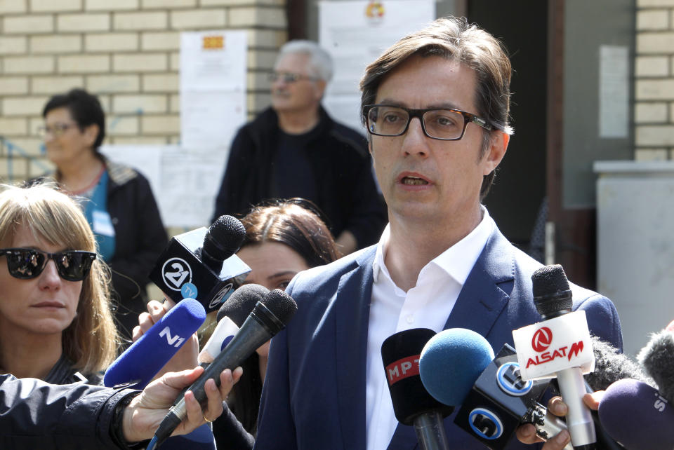 Stevo Pendarovski, presidential candidate of the ruling coalition led by the Social Democrats, talks to the media outside a polling station after voting in the presidential election in Skopje, North Macedonia, Sunday, April 21, 2019. North Macedonia holds the first round of presidential elections on Sunday, seen as key test of the government following deep polarization after the country changed its name to end a decades-old dispute with neighboring Greece over the use of the term "Macedonia". (AP Photo/Boris Grdanoski)