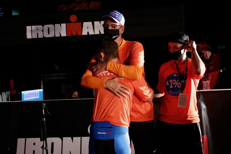 Chris Nikic hug from dad Nik at ironman finish line