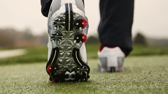 The underside of a golf cleat.