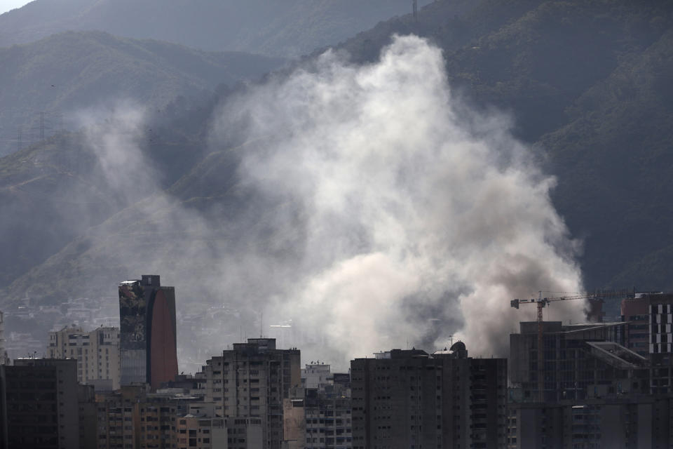 <p>Smoke rises from a police station that was set on fire while the Constituent Assembly election was being carried out in Caracas, Venezuela, July 30, 2017. (Marco Bello/Reuters) </p>