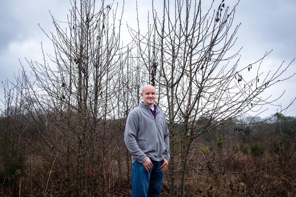 David Coyle, assistant professor of forest health and invasive species at Clemson University, at a patch of Bradford pear trees in a field behind a cemetery in Pendleton, S.C., on February 5, 2020.