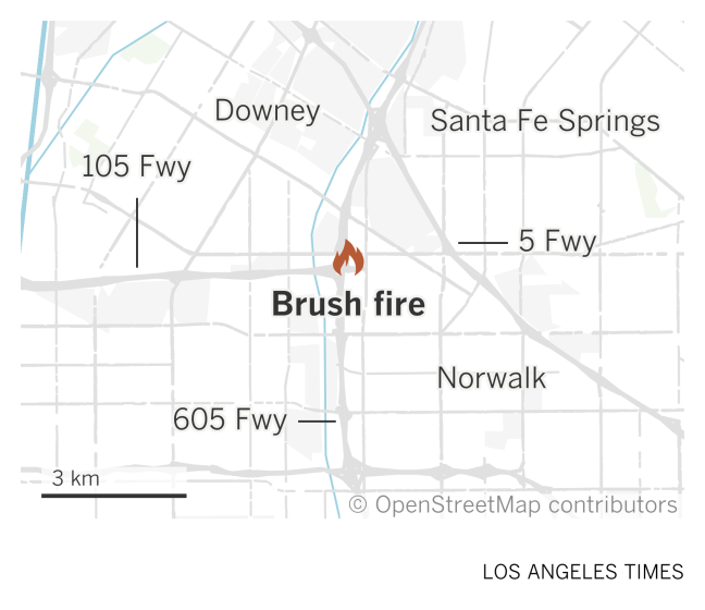 A map of southeastern Los Angeles County shows the location of a brush fire near the 105 and 605 freeways in Norwalk