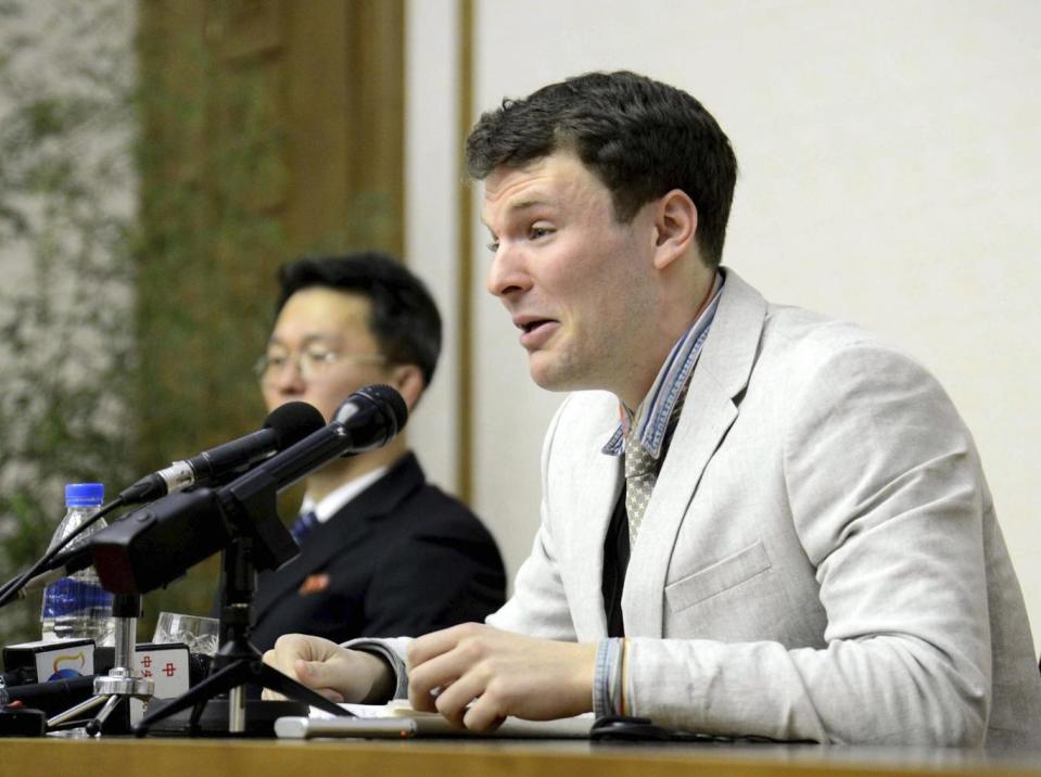 Otto Warmbier cries while speaking to reporters in Pyongyang last year (AP)