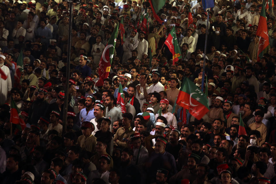 Supporters of Pakistani opposition leader Imran Khan's Tehreek-e-Insaf party attend a rally, in Peshawar, Pakistan, Tuesday, Sept. 6, 2022. Since he was toppled by parliament five months ago, former Prime Minister Imran Khan has demonstrated his popularity with rallies that have drawn huge crowds and signaled to his rivals that he remains a considerable political force. (AP Photo/Mohammad Sajjad)