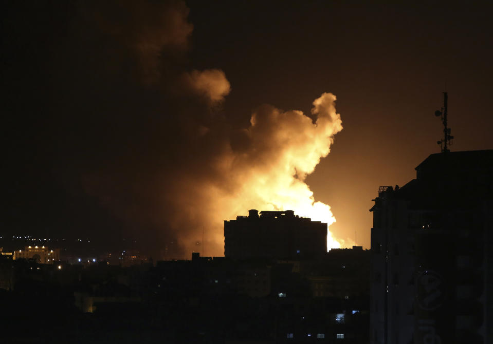 An explosion caused by Israeli airstrikes is seen on Gaza City, early Saturday, Oct. 27, 2018. Israeli aircraft struck several militant sites across the Gaza Strip early Saturday shortly after militants fired rockets into southern Israel, the Israeli military said. (AP Photo/Adel Hana)