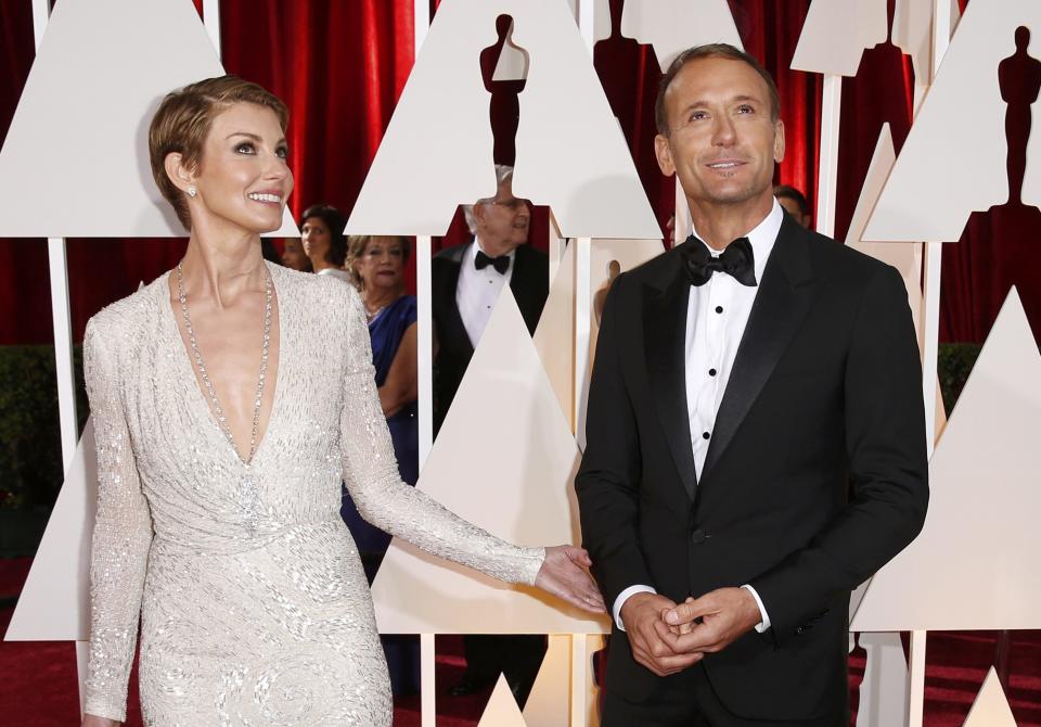 Oscars performer Tim McGraw and his wife Faith Hill arrive together at the 87th Academy Awards in Hollywood, California