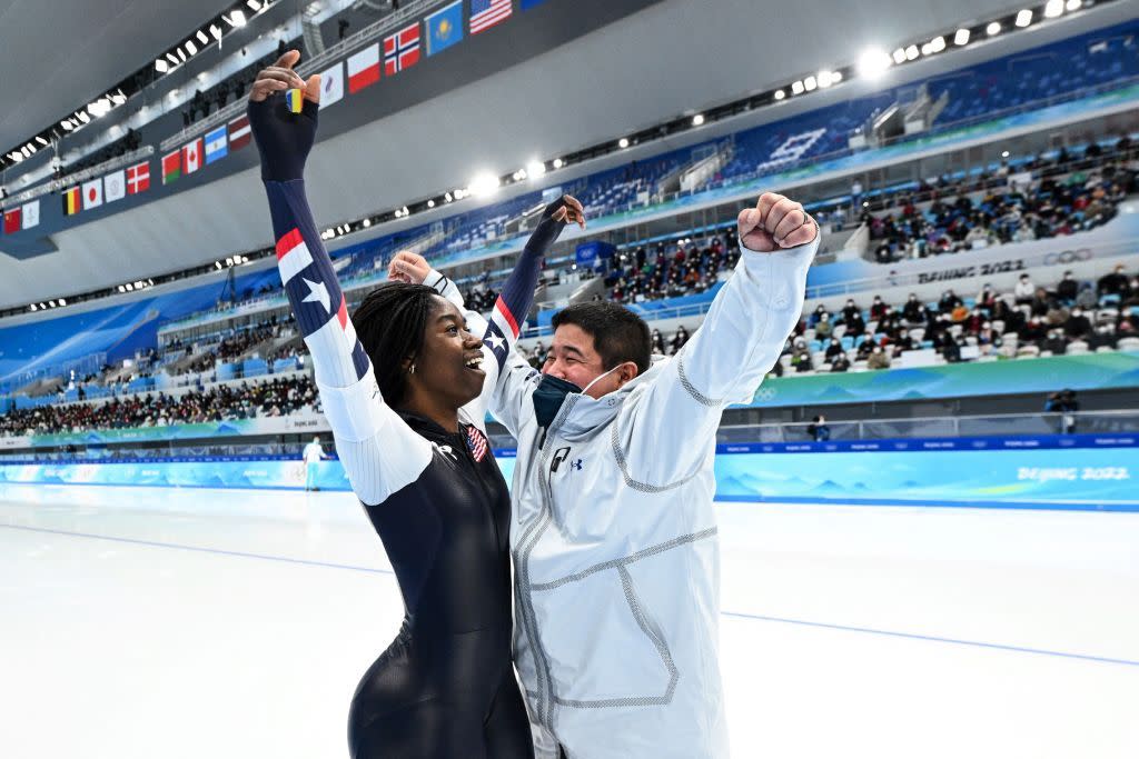 erin jackson and her coach celebrating her medal victory