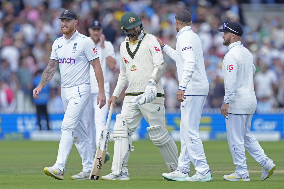 England players congratulate Australia's Nathan Lyon, center, for batting when he was injured during the fourth day of the second Ashes Test match between England and Australia, at Lord's cricket ground in London, Saturday, July 1, 2023. (AP Photo/Kirsty Wigglesworth)