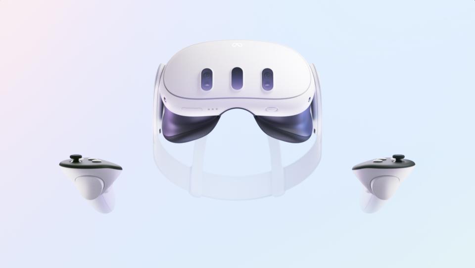 The Oculus Quest 3 and its controllers, front on, on a baby blue background