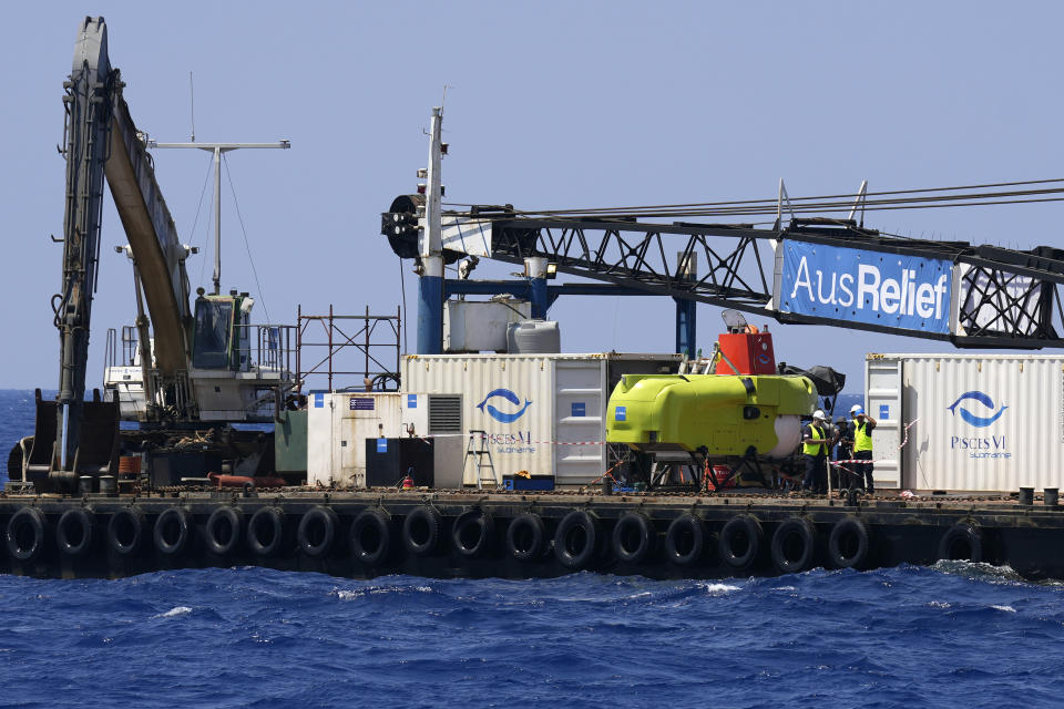 Lebanese naval forces and technical personnel prepare to dispatch a submarine into the Mediterranean Sea to attempt to recover an estimated 30 bodies some 450 meters below the surface inside a migrant ship that sunk at night four months ago about five km (3.1 miles) outside the the port of Tripoli, under disputed circumstances disputed, northern Lebanon, Monday, Aug. 22, 2022. The Lebanese Army said in a statement the high tide made it difficult to properly dispatch the submarine. Survivors accuse the army of sinking the ship, but the army claims the boat crashed into them. (AP Photo/Bilal Hussein)