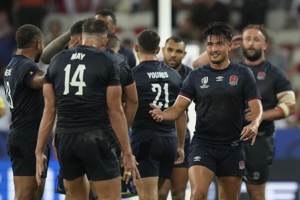 England's Marcus Smith, right reacts after the end of the Rugby World Cup Pool D match between England and Japan in the Stade de Nice, in Nice, France Sunday, Sept. 17, 2023. England won the game 34-12. (AP Photo/Pavel Golovkin)