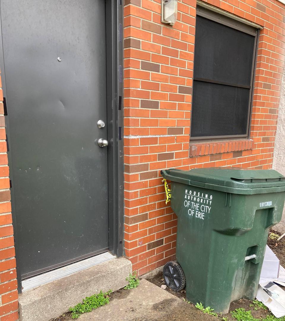 On April 4, remnants of police tape remain on a garbage can outside the back door of an Erie Housing Authority Apartment in the 200 block of East 17th Street. The night of Feb. 28, 2-year-old Zemina Smith left the apartment, wandered outside and died of hypothermia in the early morning of Feb. 29.