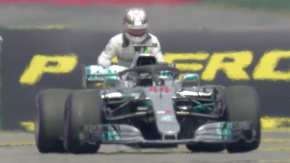 Hamilton literally tried pushing his car back to the pits. Pic: F1