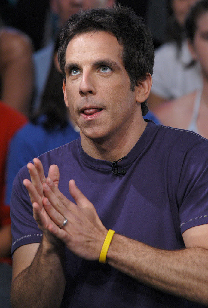 Ben Stiller with his hands together and wearing a Livestrong bracelet