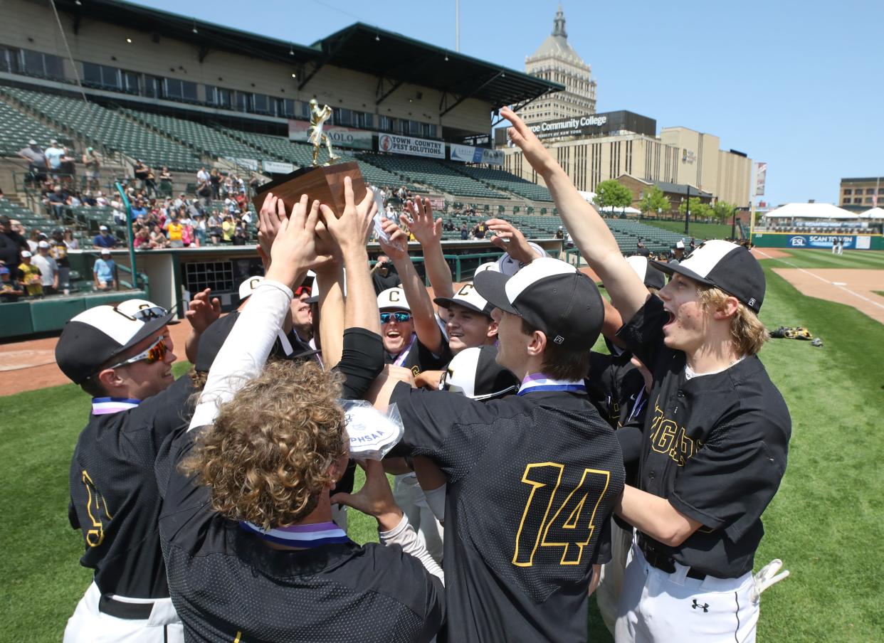 HF-L celebrate with the Championship brick after their Section V Class A2 Championship win over Pittsford Sutherland 11- 2.