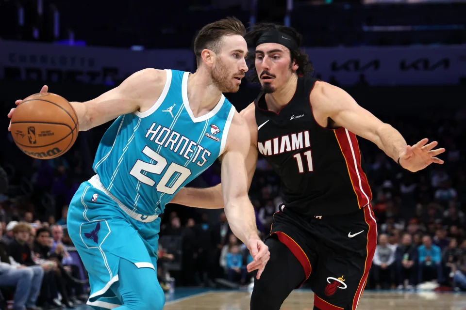 CHARLOTTE, NORTH CAROLINA - DECEMBER 11: Gordon Hayward #20 of the Charlotte Hornets drives to the basket against Jaime Jaquez Jr. #11 of the Miami Heat during the second quarter of their game at Spectrum Center on December 11, 2023 in Charlotte, North Carolina. NOTE TO USER: User expressly acknowledges and agrees that, by downloading and or using this photograph, User is consenting to the terms and conditions of the Getty Images License Agreement. (Photo by Jared C. Tilton/Getty Images)